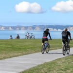 Cyclists on Rotary Pathway looking towards Cape Kidnappers.